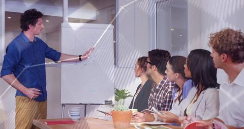 Diverse Team in Collaborative Meeting with Flipchart Presentation