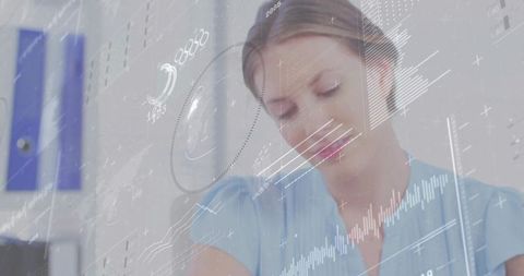 Young professional studying digital charts with hud overlays in minimal office workspace