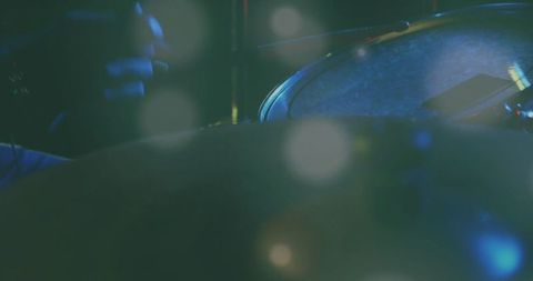 Snare Drum Close-Up with Drumstick Under Soft Stage Lighting