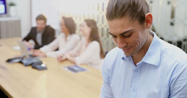 Young professional feeling shy during business meeting in modern office - Download Free Stock Images Pikwizard.com