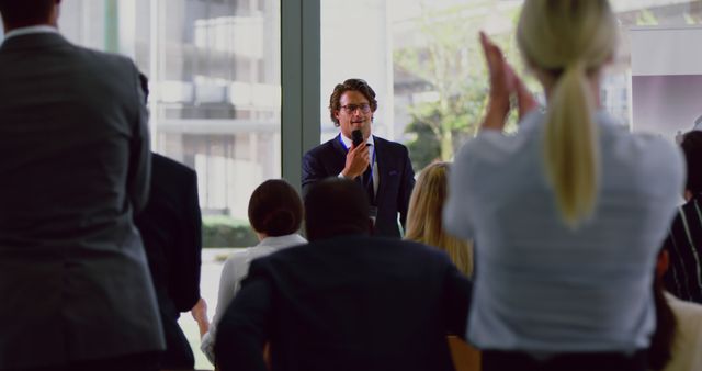 Businessman confidently giving presentation in conference room to attentive audience. Perfect for content on office meetings, leadership, public speaking, corporate training, teamwork, and professional development. It is an ideal illustration for articles, blogs, and advertisements highlighting collaborative work environments and effective communication in business.