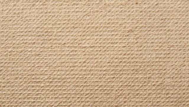 Beige fibrous textured surface with embossed diagonal grid and subtle diamond pattern
