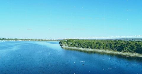 Futuristic Digital Data Overlaid on Tranquil Reservoir Water View