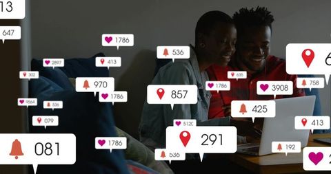 Couple browsing laptop with social media notifications, digital engagement at home