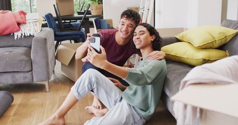 Moving In Day Joy: Couple Taking Selfie in New Home