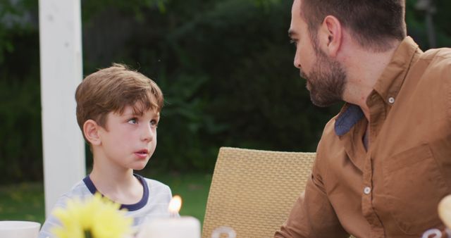 Father and Son Having Serious Conversation in Garden - Download Free Stock Images Pikwizard.com