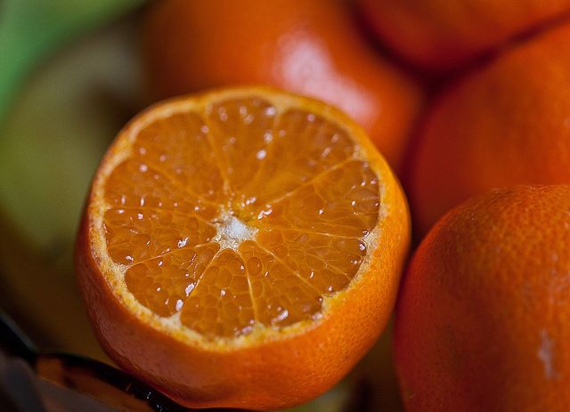 Close-up of a Fresh Juicy Orange Cut in Half - Download Free Stock Photos Pikwizard.com