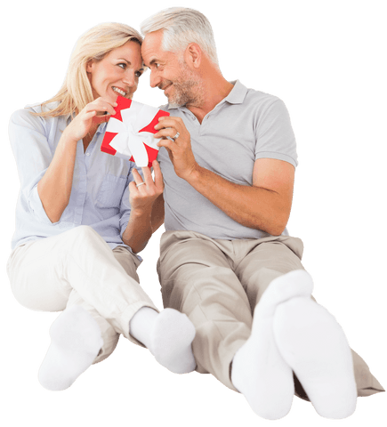 Happy Mature Couple Sharing Gift with Transparent Background