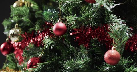 Festive Red Baubles Adorning Christmas Tree with Garland - Download Free Stock Images Pikwizard.com