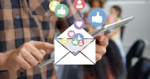 Social media icons emerge from digital envelope mail concept