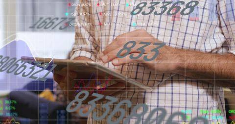 Businessman analyzing stock market data on tablet device