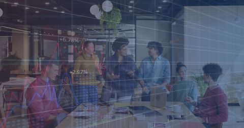 Successful Team Meeting with Diverse Group Analyzing Data Charts