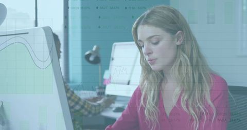 Businesswoman Analyzing Data on Computer with Graph Overlay
