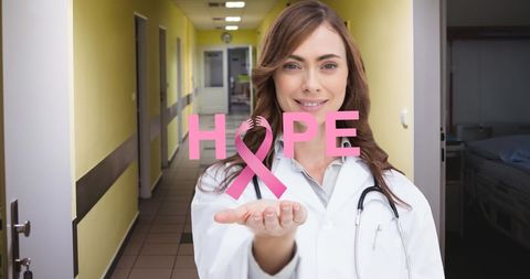 Female Doctor Promoting Breast Cancer Awareness with Pink Ribbon Symbol