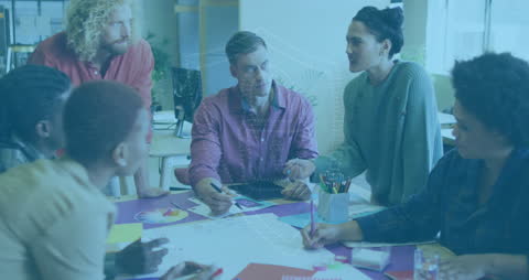 Diverse Team Collaborating on Project with Digital Interface