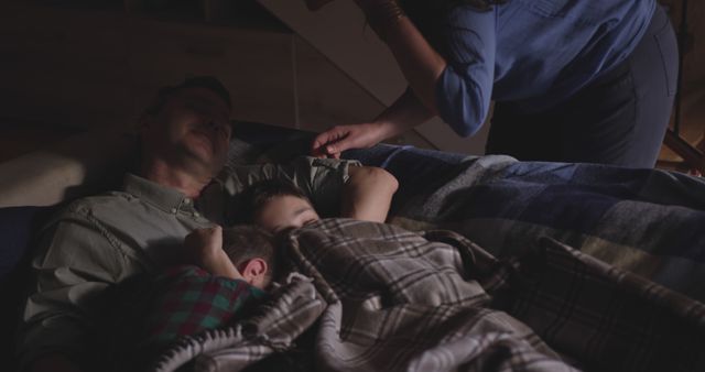 Family Cuddling in Bed at Night - Download Free Stock Images Pikwizard.com