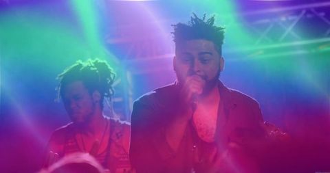 Dynamic live music club performance with colorful stage lighting