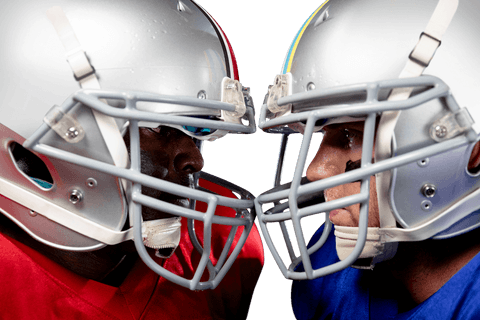 Transparent rival football players face-off helmets touching