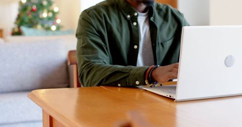 Working Remotely During Holidays by Christmas Tree