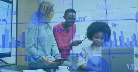 Diverse Business Team Analyzing Data on Laptop with Technology Overlay