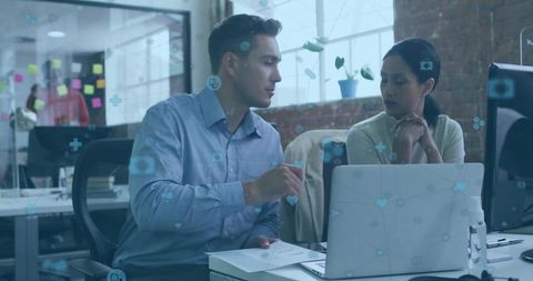 Two Professionals Collaborating in a Modern Office Environment