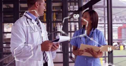 Two Doctors Discussing Medical Data with Futuristic Overlay of Chemical Structures