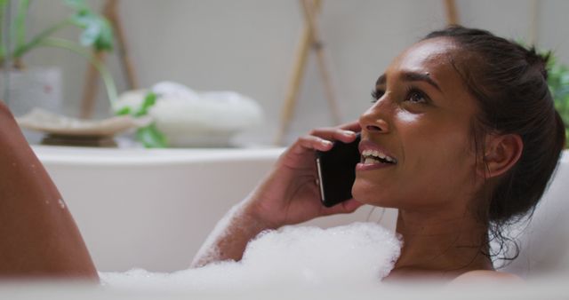 Woman Relaxing in Bubble Bath while Talking on Phone, Close-up - Download Free Stock Images Pikwizard.com