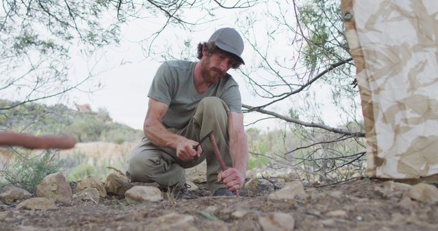 Bearded Survivalist Setting Up Camp in the Wilderness - Download Free Stock Images Pikwizard.com