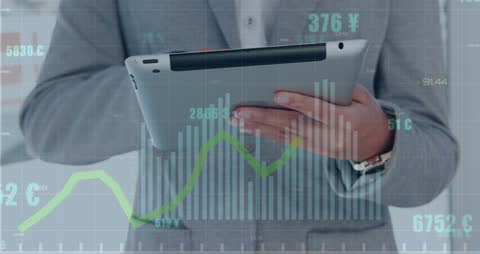 Businessman Using Tablet with Data Overlay Graphics