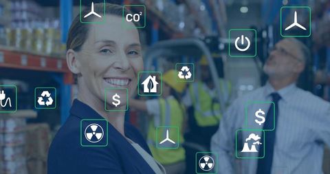 Smiling warehouse manager leading team with ar icons for logistics, sustainability, industry