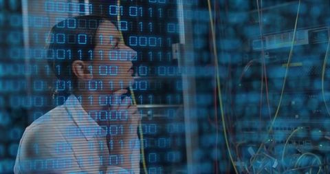Female IT Technician Managing Server in Data Center
