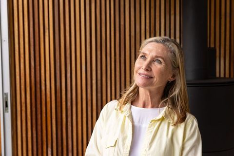 Elegant Senior Woman Indoors Looking Upward Tranquilly