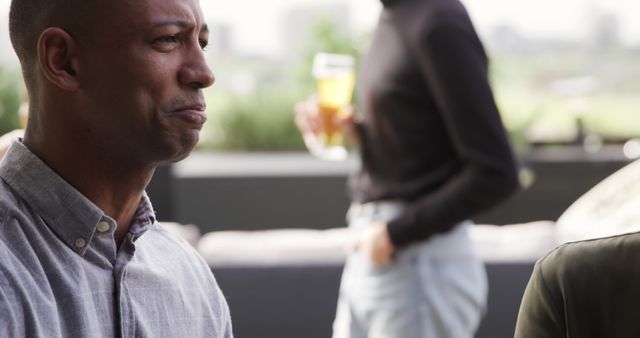 Pensive Businessman at Social Gathering - Download Free Stock Images Pikwizard.com