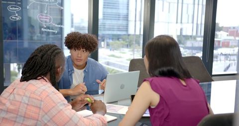 Diverse Team Collaborating on Business Projects in Modern Office