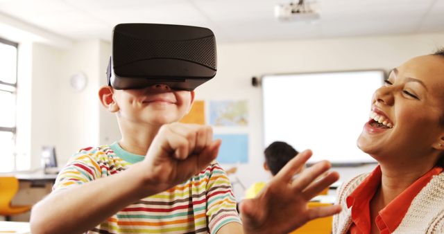 Curious Child Exploring Virtual Reality in Classroom with Teacher - Download Free Stock Images Pikwizard.com