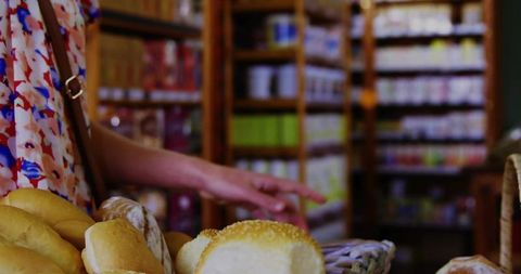 Woman Choosing Bread in Cozy Bakery with Outdoor Market Feel