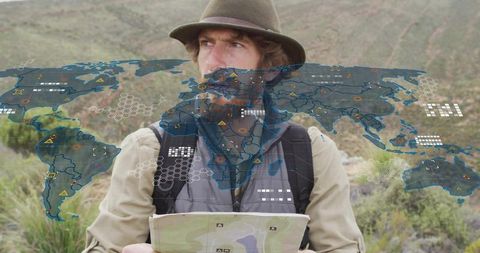 Explorer navigating wilderness with digital mapping technology