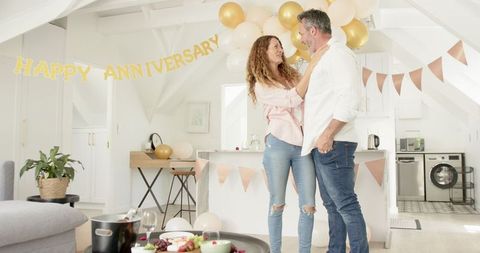 Happy Mature Couple Celebrating Anniversary at Home
