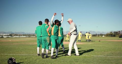 Veteran Baseball Team Celebrating Victory on Sunny Field with Coach and Helmet