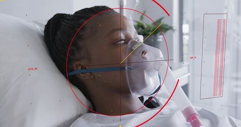 Patient receiving oxygen therapy with red hud medical overlay in hospital bed