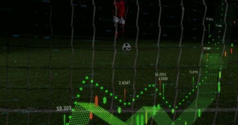 Goal net view showing soccer player taking penalty kick with green data overlay night stadium
