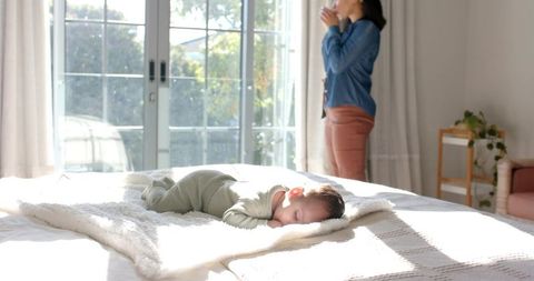 Sleeping Baby on Plush Blanket Under Natural Light