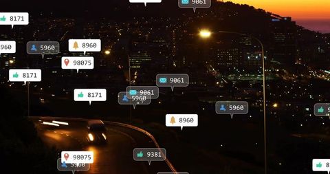 Digital Notification Overlays Hovering Above Night City Road with Car Light Trails