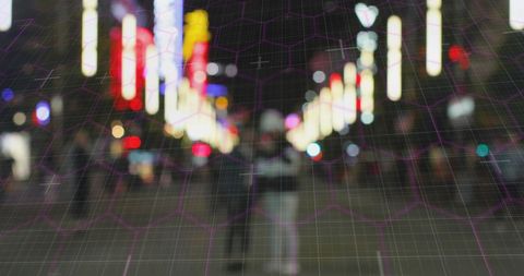 Blurred City Lights with Geometric Overlay at Night