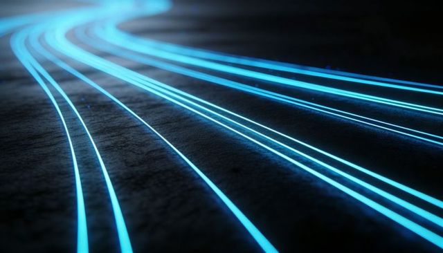 Curving cyan light trails on rough asphalt leading futuristic neon urban technology