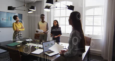 Diverse Team Collaborating on Digital Reports and Analysis