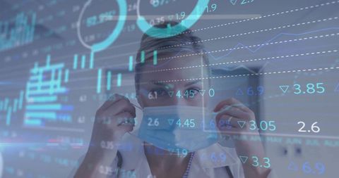 Clinician Adjusting Face Mask While Viewing Digital Health Charts and Analytics Overlay