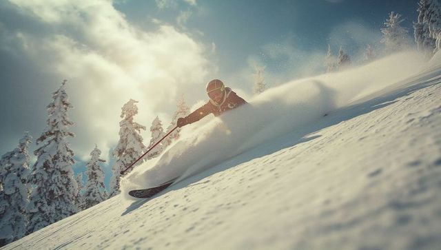 Adventurous Skier Navigating Powdered Alpine Slope with Precision