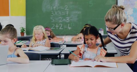 Teacher Guiding Students in Interactive Classroom Environment - Download Free Stock Images Pikwizard.com