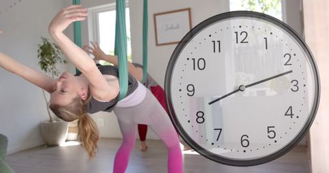 Dynamic aerial yoga with fast-moving clock concept